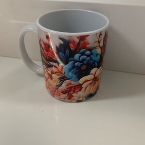 Elegant Floral Mug with Blue and Red Accents